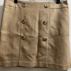 Tan mini skirt.
